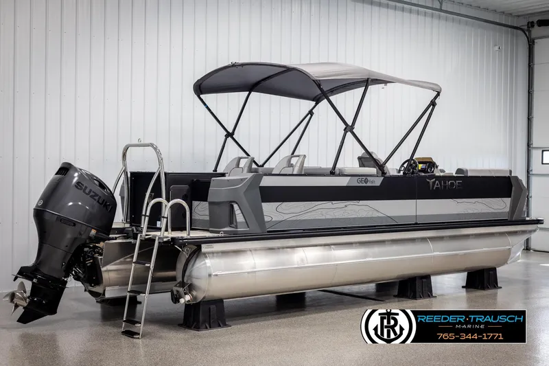 Slide: The Image of 2025 Tahoe TGO RF pontoon boat with Suzuki outboard motor in showroom. - 6