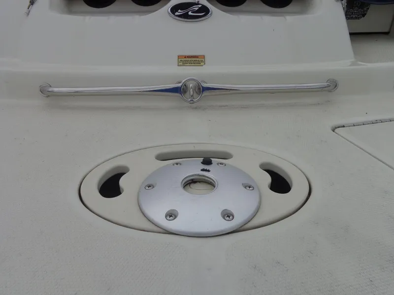 Slide: The Image of 2007 Sea Ray 200 Sundeck boat deck with metal fittings and logo. - 21