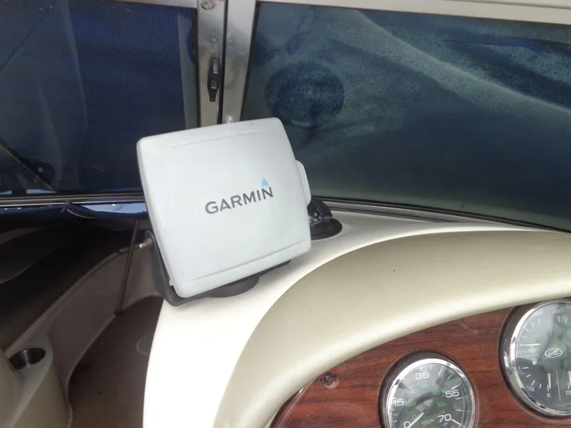 Slide: The Image of Garmin GPS on 2007 Sea Ray 200 Sundeck dashboard with gauges. - 34