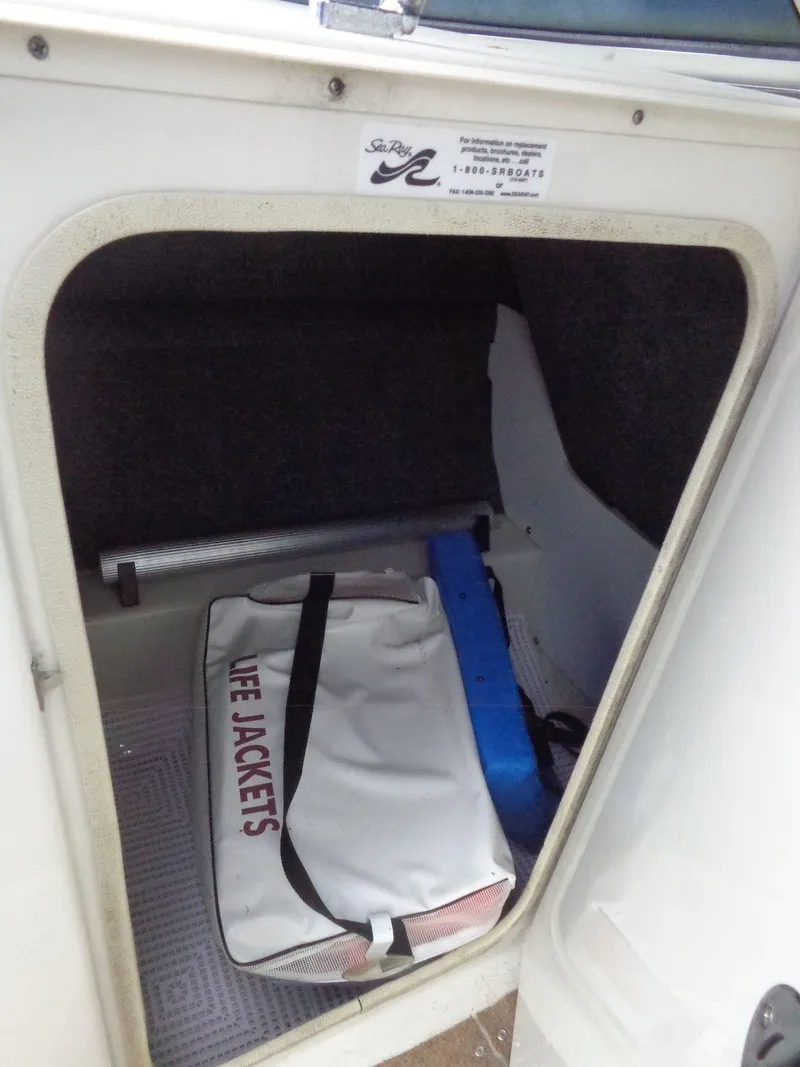 Slide: The Image of Storage compartment in 2007 Sea Ray 200 Sundeck with life jackets bag. - 42