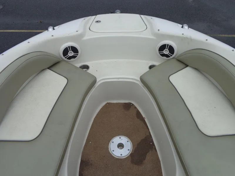 Slide: The Image of 2007 Sea Ray 200 Sundeck boat interior with cushioned seating and speakers. - 49