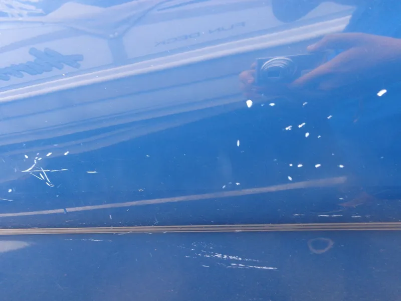 Slide: The Image of Reflection on blue surface of 2007 Sea Ray 200 Sundeck boat. - 6