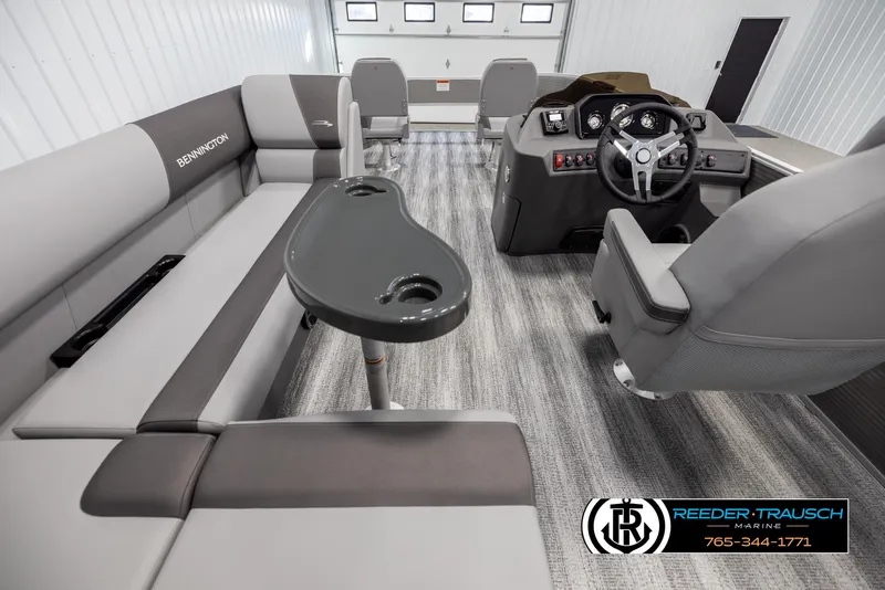 Slide: The Image of 2025 Bennington 21 SFSE boat interior with modern seating and steering console. - 17