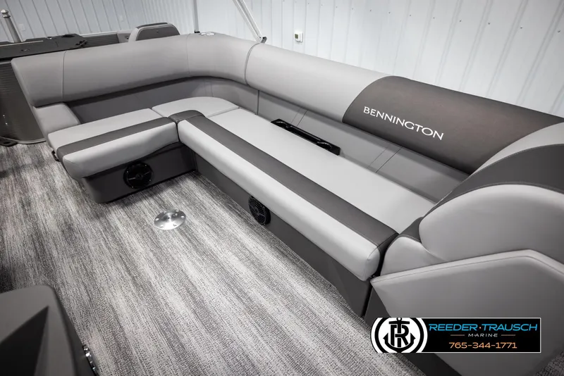 Slide: The Image of 2025 Bennington 21 SFSE boat interior with gray seating and carpeted flooring. - 23