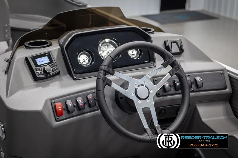 Slide: The Image of 2025 Bennington 21 SFSE boat dashboard with steering wheel and control panel. - 27