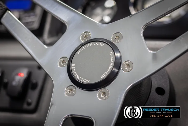 Slide: The Image of Steering wheel of 2025 Bennington 21 SFSE boat, featuring sleek metallic design. - 28