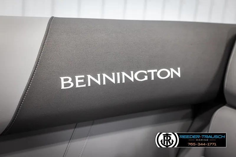 Slide: The Image of 2025 Bennington 21 SFSE boat seat with logo, featuring sleek gray upholstery. - 38