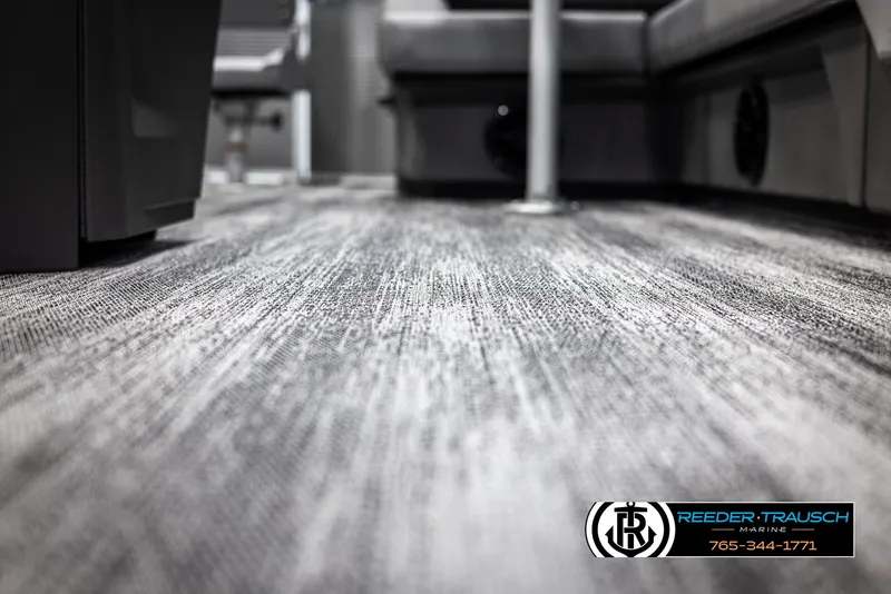 Slide: The Image of 2025 Bennington 21 SFSE interior flooring with modern design, featuring Reeder-Trausch Marine branding. - 45