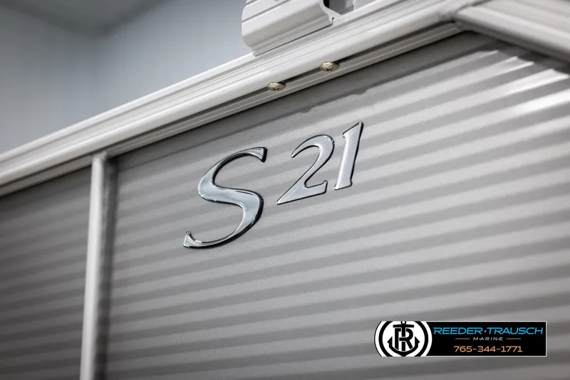 Slide: The Image of 2025 Bennington 21 SFSE boat with "S 21" emblem, Reeder-Trausch Marine logo visible. - 49