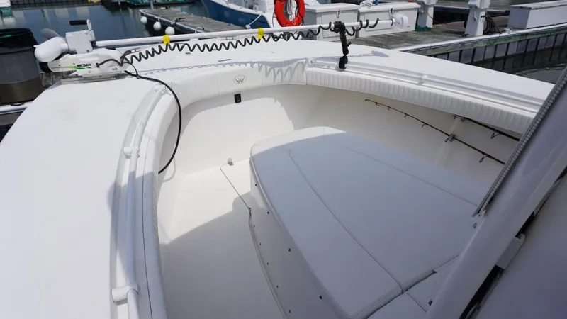 Slide: The Image of 2005 Southport 28 Center Console boat interior with white seating and clean design. - 10