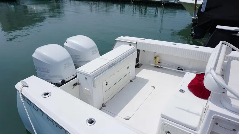 Slide: The Image of 2005 Southport 28 Center Console boat with dual engines docked in marina. - 8