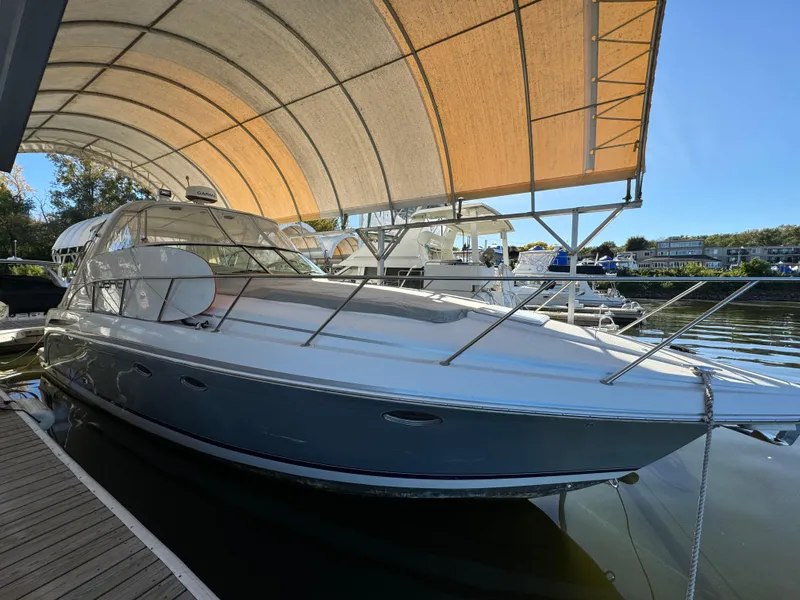 The Image of 2004 Formula 37 Performance Cruiser docked under canopy. - 0