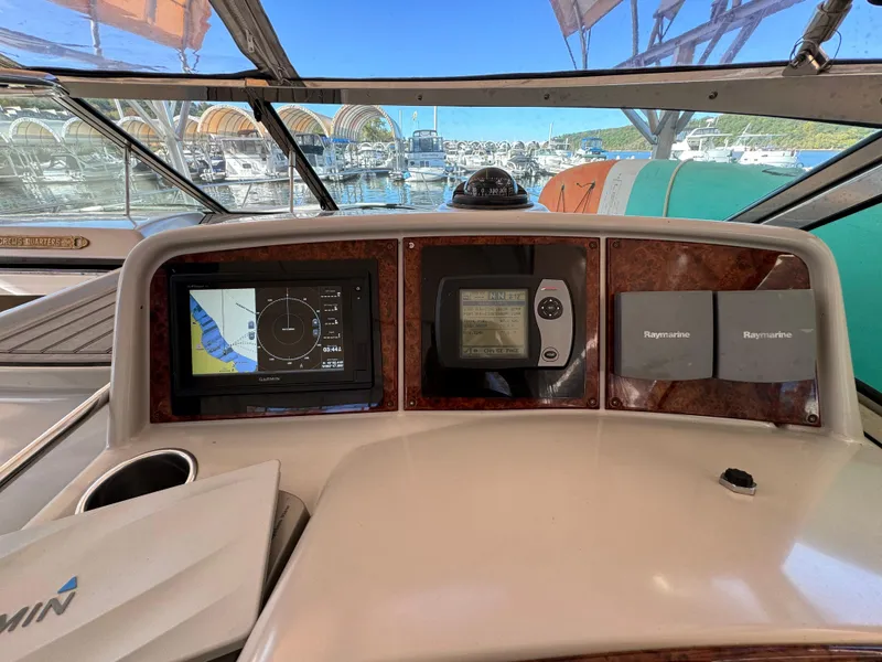 Slide: The Image of Dashboard of a 2004 Formula 37 Performance Cruiser with navigation equipment. - 10