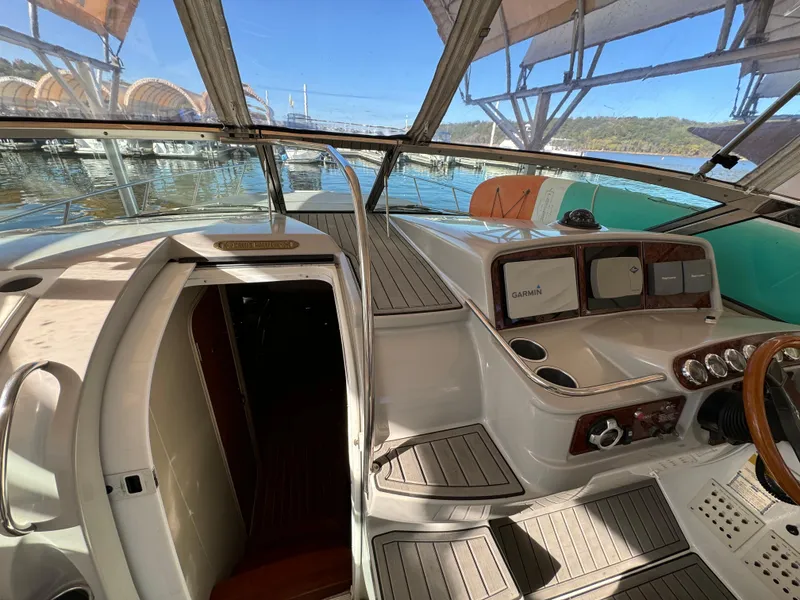 Slide: The Image of 2004 Formula 37 Performance Cruiser cockpit with helm, controls, and cabin entrance. - 15