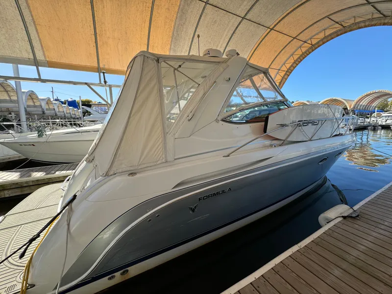 Slide: The Image of 2004 Formula 37 Performance Cruiser docked under canopy. - 2