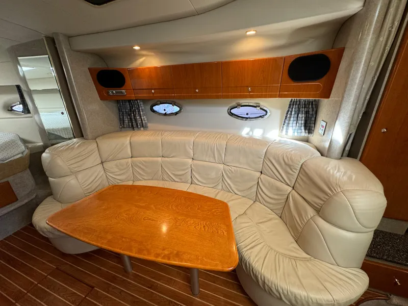 Slide: The Image of 2004 Formula 37 Performance Cruiser interior with leather seating and wooden table. - 22