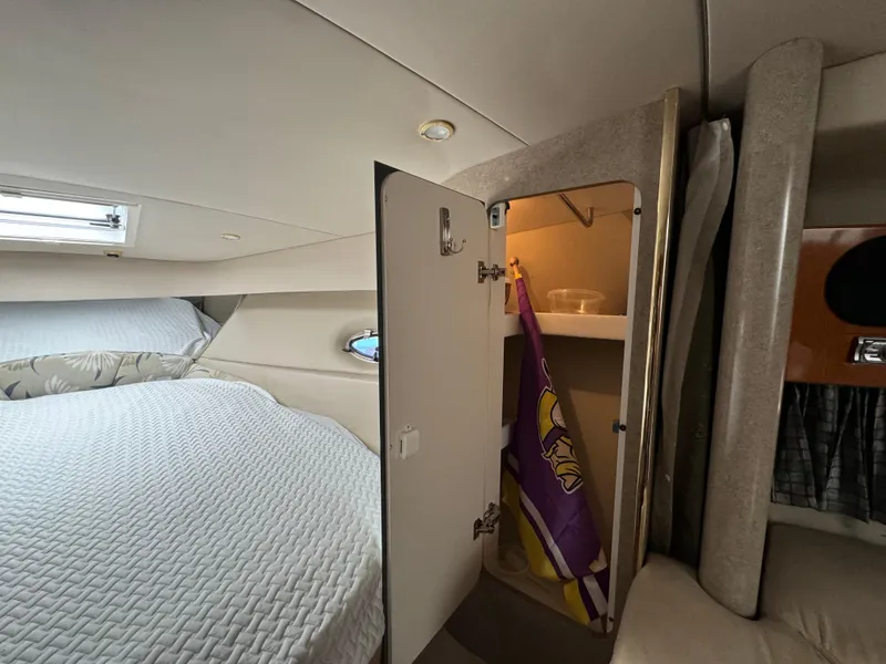 Slide: The Image of Interior of a 2004 Formula 37 Performance Cruiser with bed and open closet. - 25