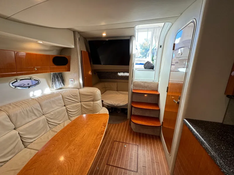 Slide: The Image of Interior of 2004 Formula 37 Performance Cruiser with wood accents and plush seating. - 26