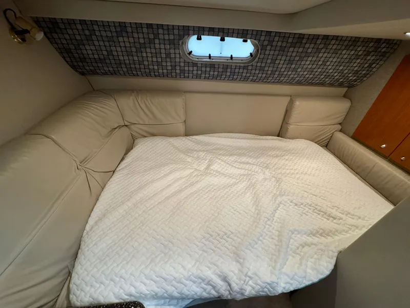 Slide: The Image of Interior cabin of 2004 Formula 37 Performance Cruiser with cozy bed and porthole window. - 28