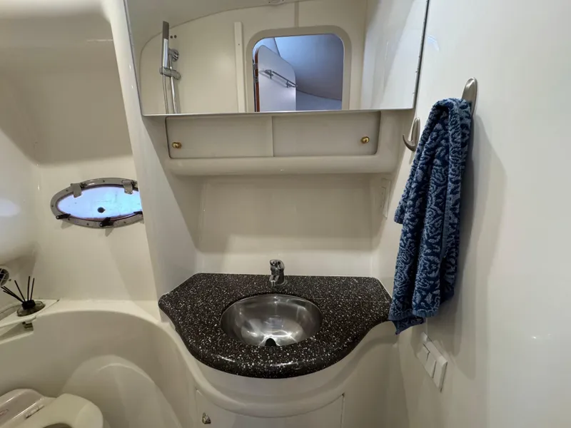 Slide: The Image of 2004 Formula 37 Performance Cruiser bathroom with sink, mirror, and towel. - 34