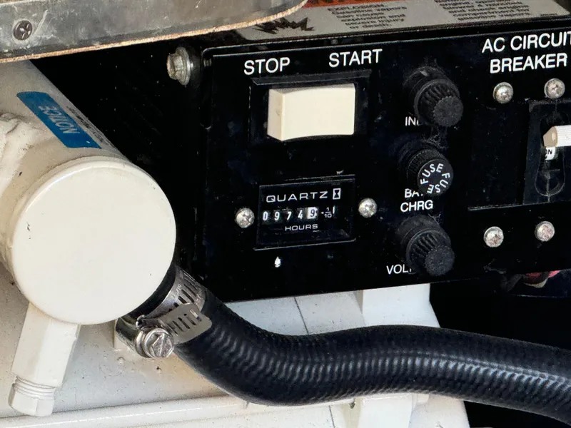 Slide: The Image of Control panel of a 2004 Formula 37 Performance Cruiser with hour meter and circuit breaker. - 40