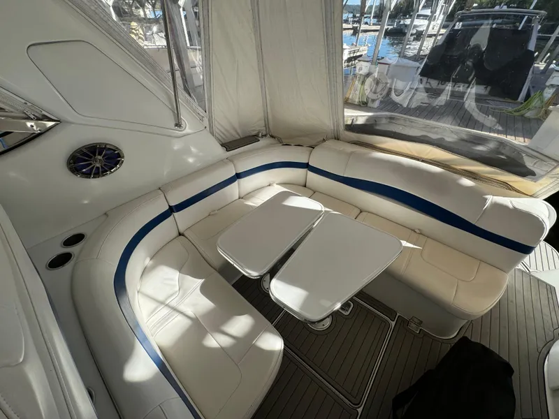 Slide: The Image of 2004 Formula 37 Performance Cruiser interior with white seating and dual tables. - 6