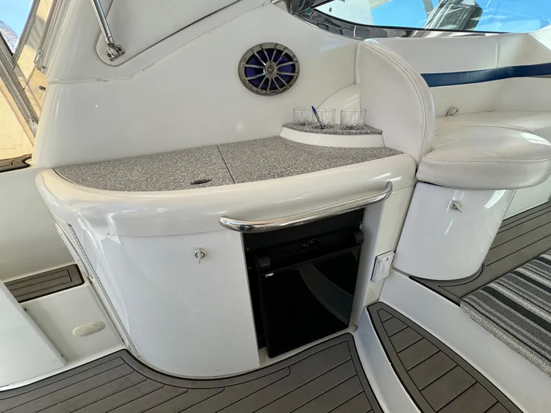 Slide: The Image of 2004 Formula 37 Performance Cruiser interior with mini fridge and seating area. - 7