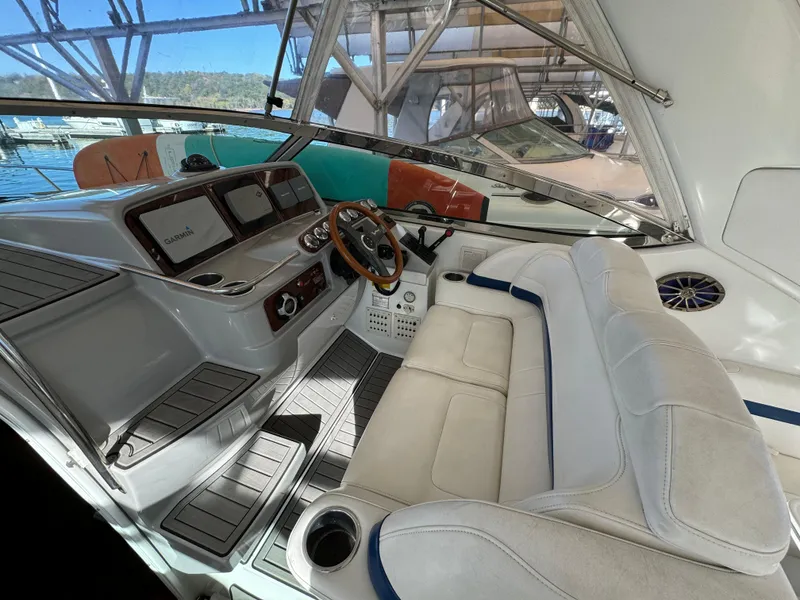Slide: The Image of 2004 Formula 37 Performance Cruiser cockpit with white seating and modern dashboard. - 8