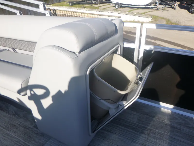 Slide: The Image of 2024 Ranger Reata 223C boat interior with storage compartment open. - 22