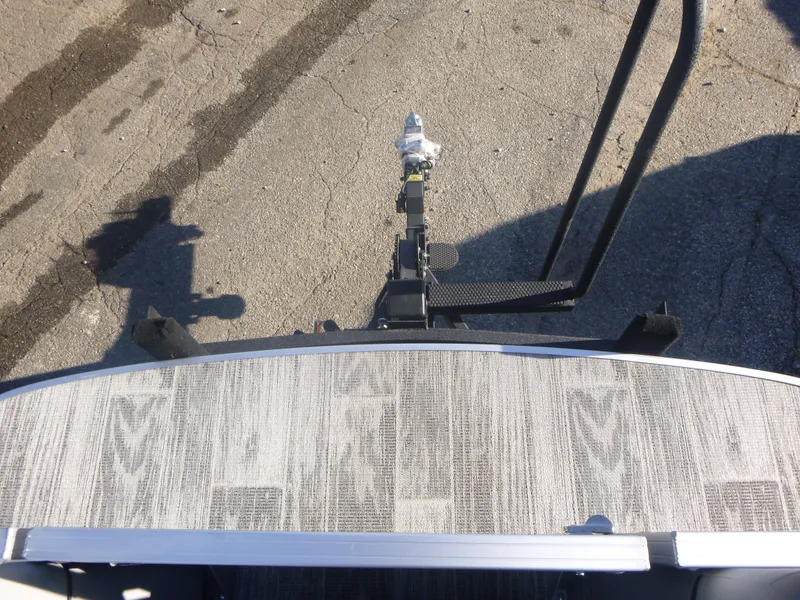 Slide: The Image of 2024 Ranger Reata 223C boat trailer hitch on asphalt surface. - 31