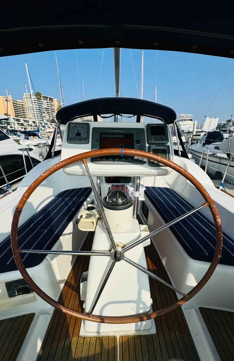 Slide: The Image of Cockpit view of 2007 Jeanneau Sun Odyssey 36i sailboat with wooden steering wheel. - 10