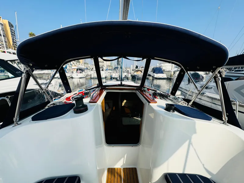 Slide: The Image of 2007 Jeanneau Sun Odyssey 36i sailboat cockpit with canopy, docked in marina. - 13