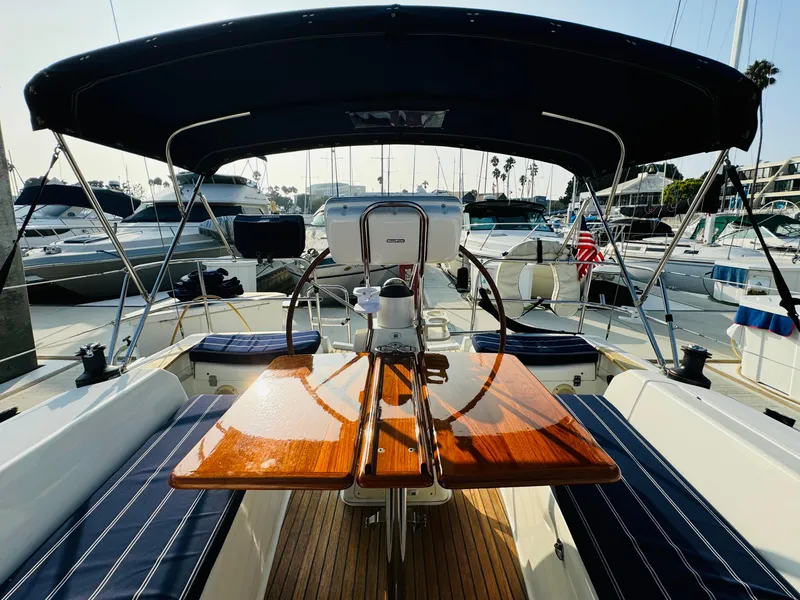 Slide: The Image of Jeanneau Sun Odyssey 36i 2007 sailboat with polished wood table and navy seating. - 18