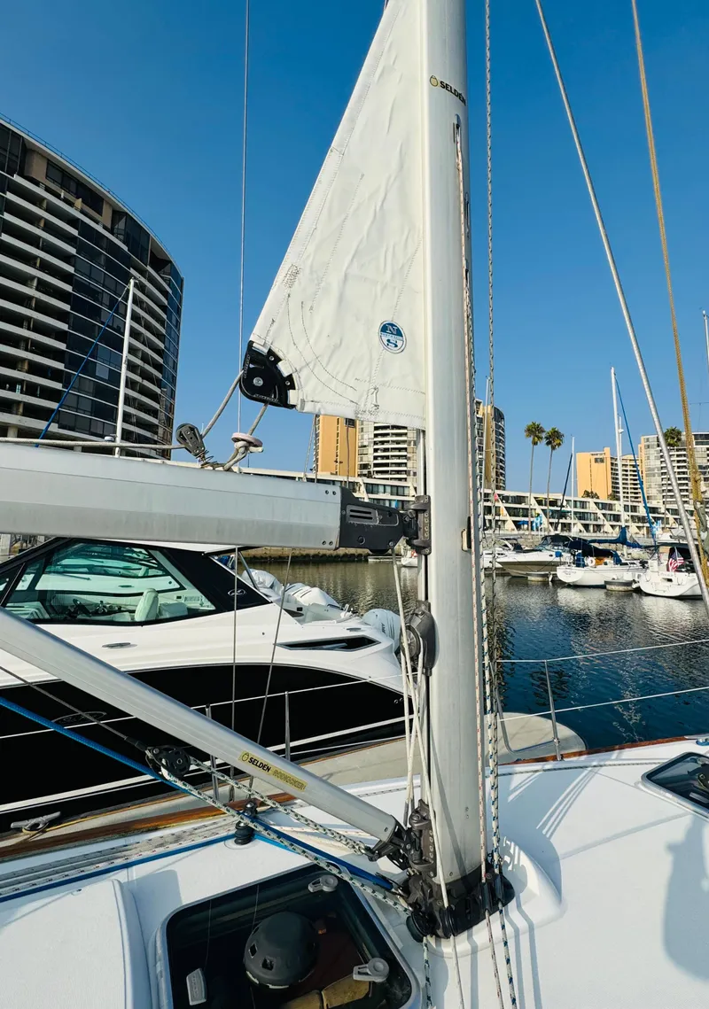 Slide: The Image of 2007 Jeanneau Sun Odyssey 36i sailboat docked in marina, clear blue sky. - 24