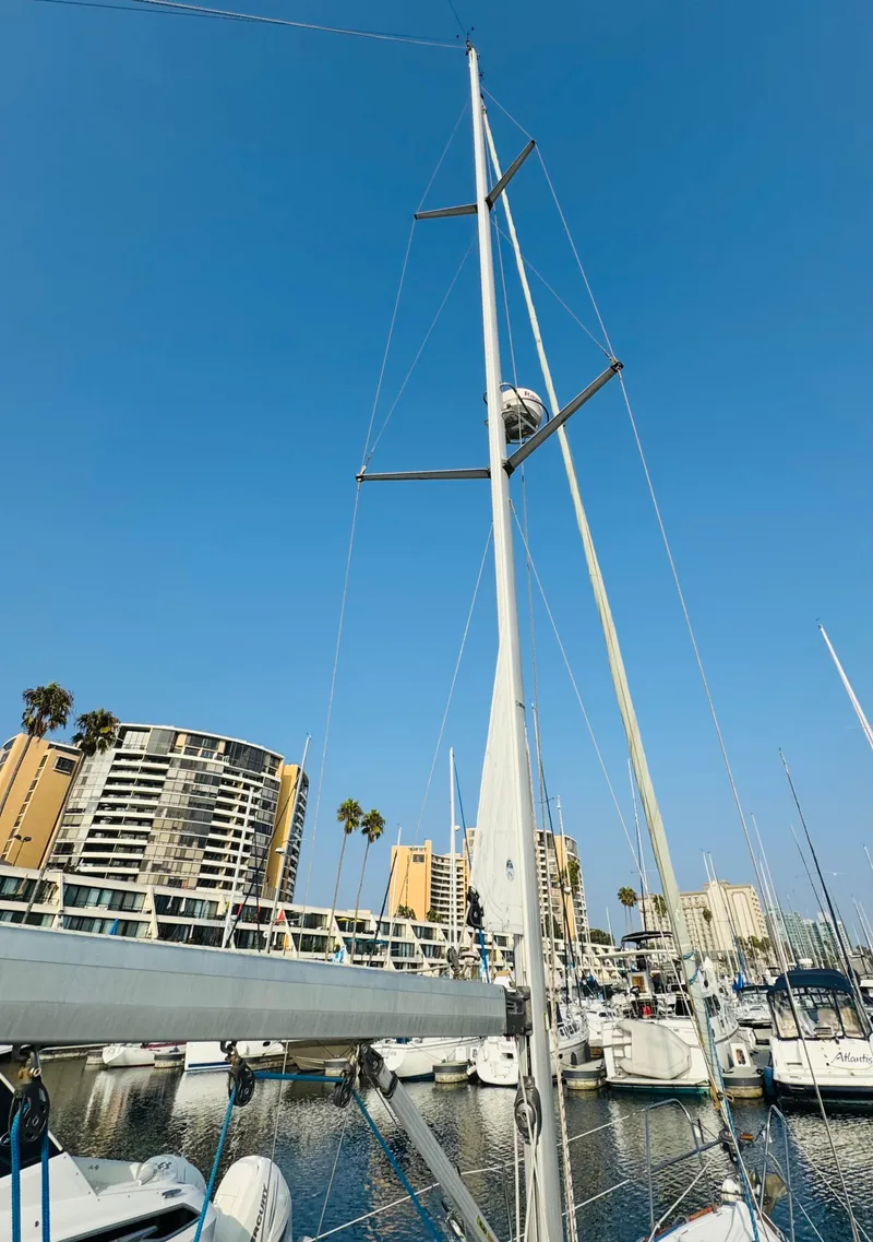 Slide: The Image of 2007 Jeanneau Sun Odyssey 36i sailboat docked in marina, clear blue sky. - 25