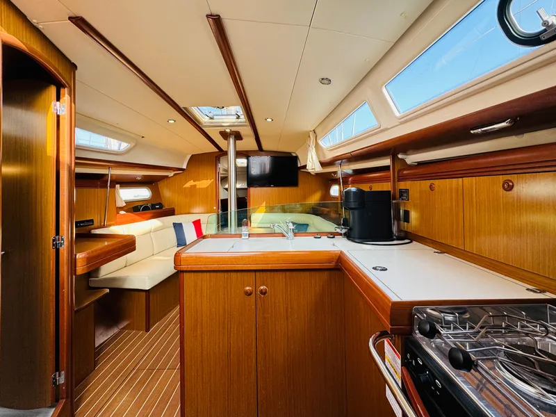 Slide: The Image of Interior of 2007 Jeanneau Sun Odyssey 36i sailboat with wood finish and modern amenities. - 30