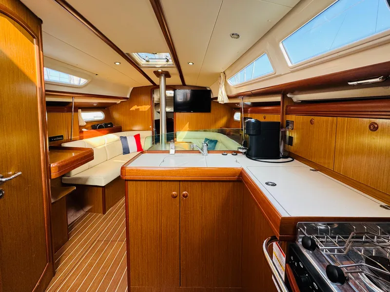 Slide: The Image of Interior of 2007 Jeanneau Sun Odyssey 36i sailboat with wood finish and modern amenities. - 31