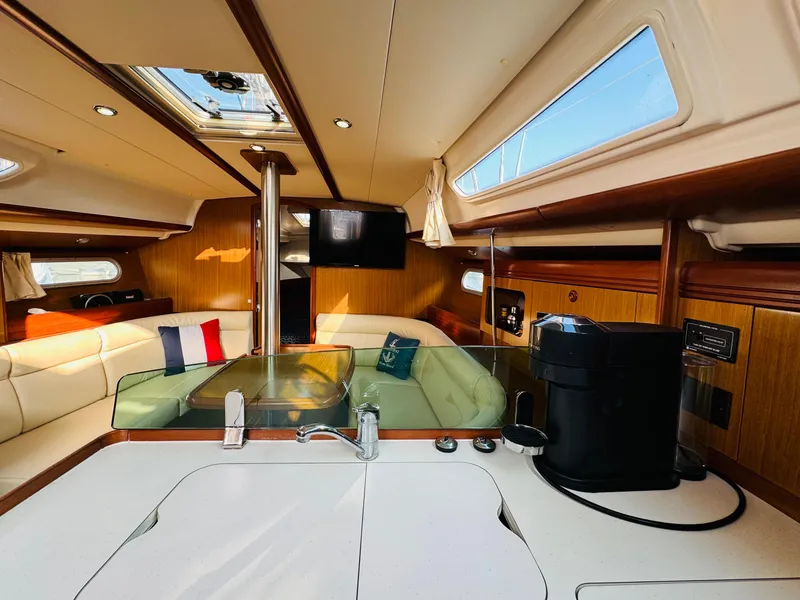 Slide: The Image of Interior of 2007 Jeanneau Sun Odyssey 36i yacht with modern kitchen and seating area. - 32