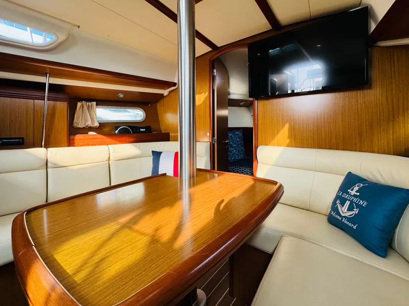 Slide: The Image of Interior of 2007 Jeanneau Sun Odyssey 36i yacht with cozy seating and wooden finishes. - 35