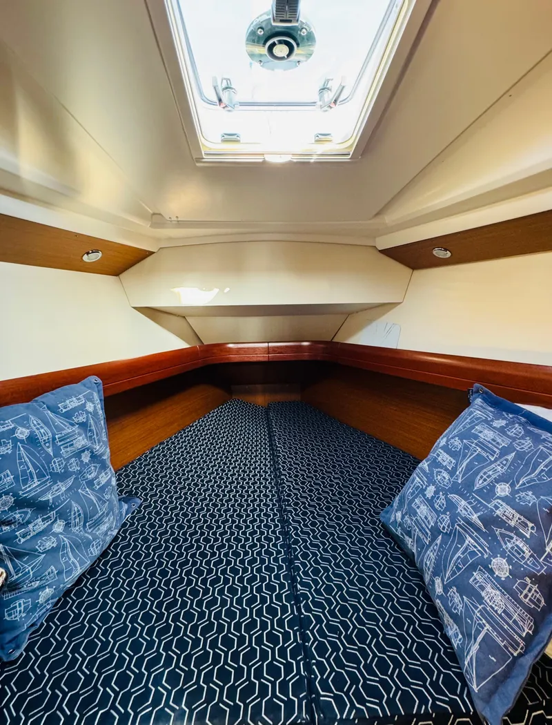 Slide: The Image of Interior cabin of 2007 Jeanneau Sun Odyssey 36i sailboat with patterned bedding. - 46