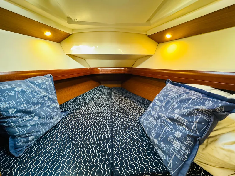 Slide: The Image of Cozy cabin interior of 2007 Jeanneau Sun Odyssey 36i sailboat with nautical-themed pillows. - 47