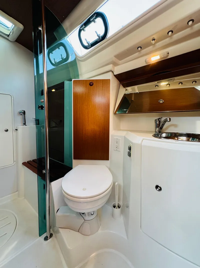 Slide: The Image of 2007 Jeanneau Sun Odyssey 36i yacht bathroom with modern fixtures and wood accents. - 49