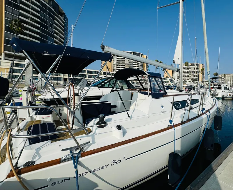 Slide: The Image of 2007 Jeanneau Sun Odyssey 36i sailboat docked in marina, clear blue sky. - 6