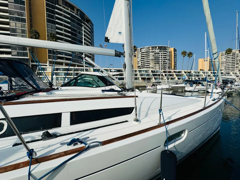 Slide: The Image of Jeanneau Sun Odyssey 36i 2007 sailboat docked in marina with modern buildings. - 8