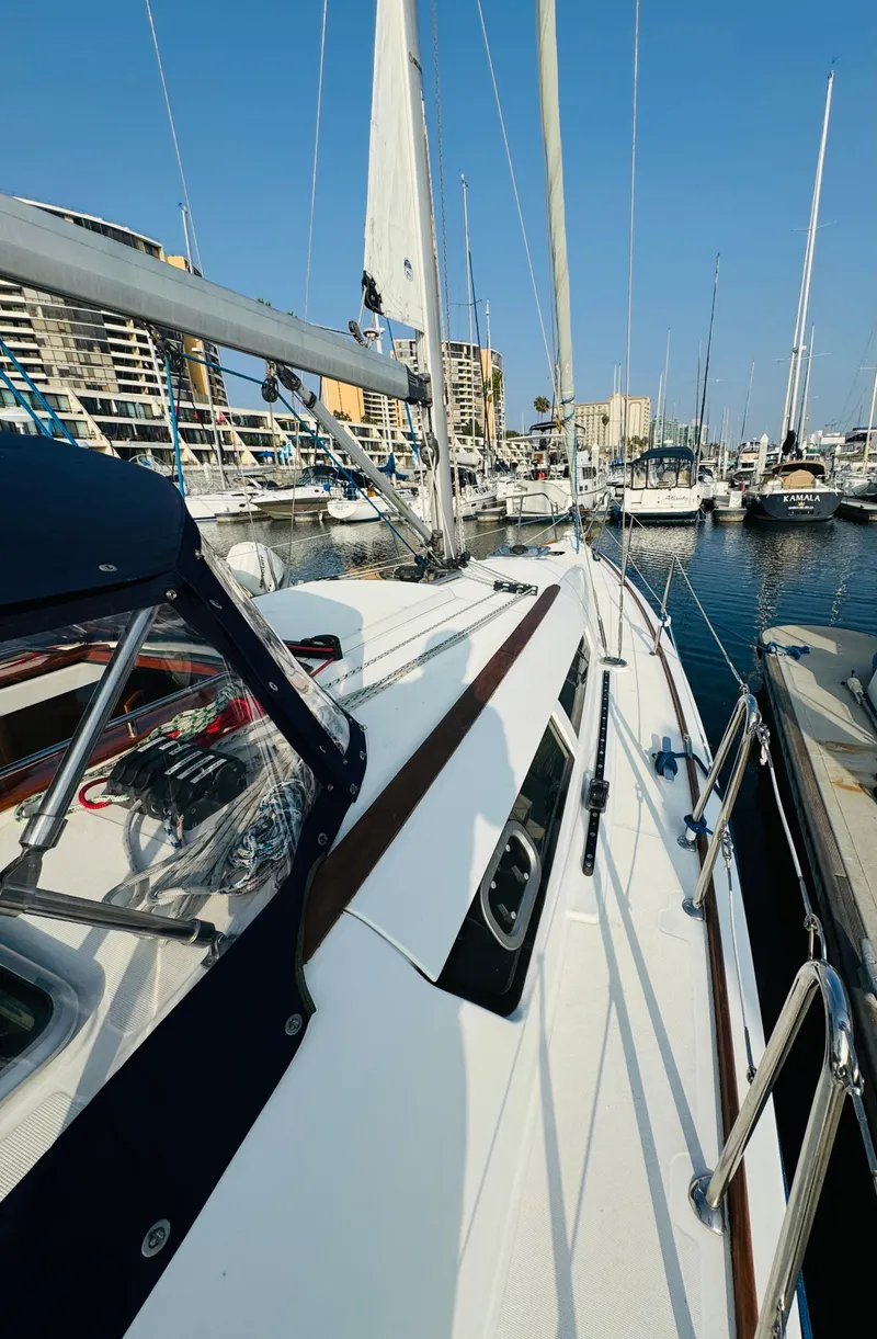 Slide: The Image of 2007 Jeanneau Sun Odyssey 36i sailboat docked in marina, clear blue sky. - 9