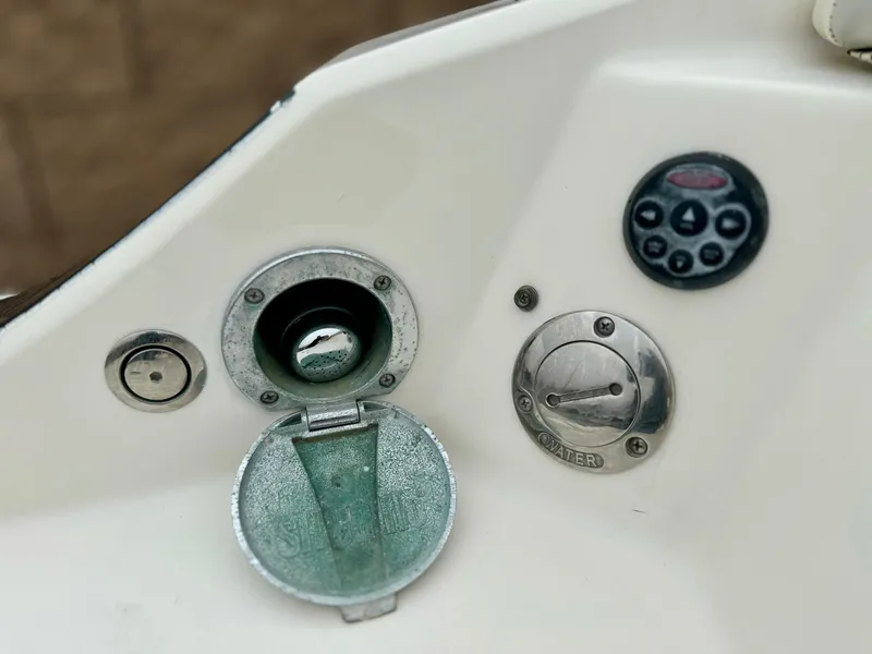 Slide: The Image of 2006 Larson LXi 248 boat propeller and outdrive close-up. - 8