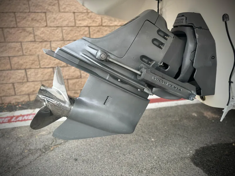 Slide: The Image of 2006 Larson LXi 248 boat with white seating and sleek design. - 9