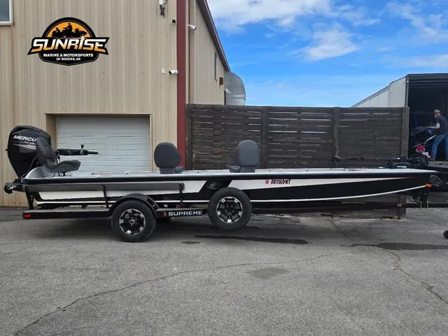 Slide: The Image of 2018 Supreme 207XP fishing boat parked outdoors on a sunny day. - 1