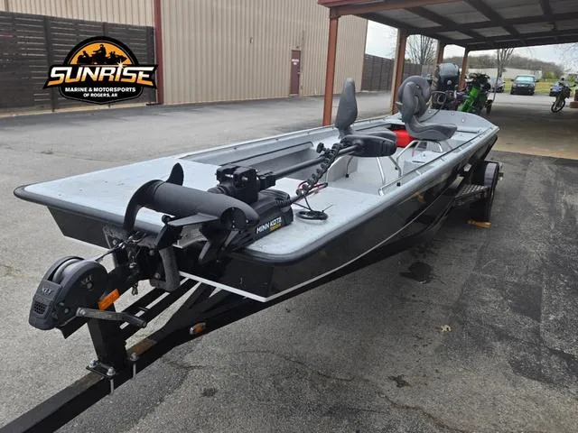 Slide: The Image of 2018 Supreme 207XP boat engine, black, mounted on a trailer, sunny day. - 12