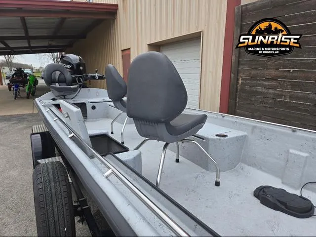 Slide: The Image of 2018 Supreme 207XP boat with Mercury FourStroke outboard motor, parked outdoors. - 16